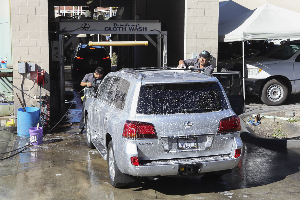 A car about to go through a machine wash