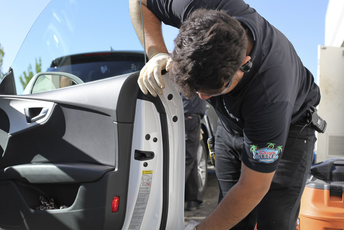 Our worker inspecting a car door