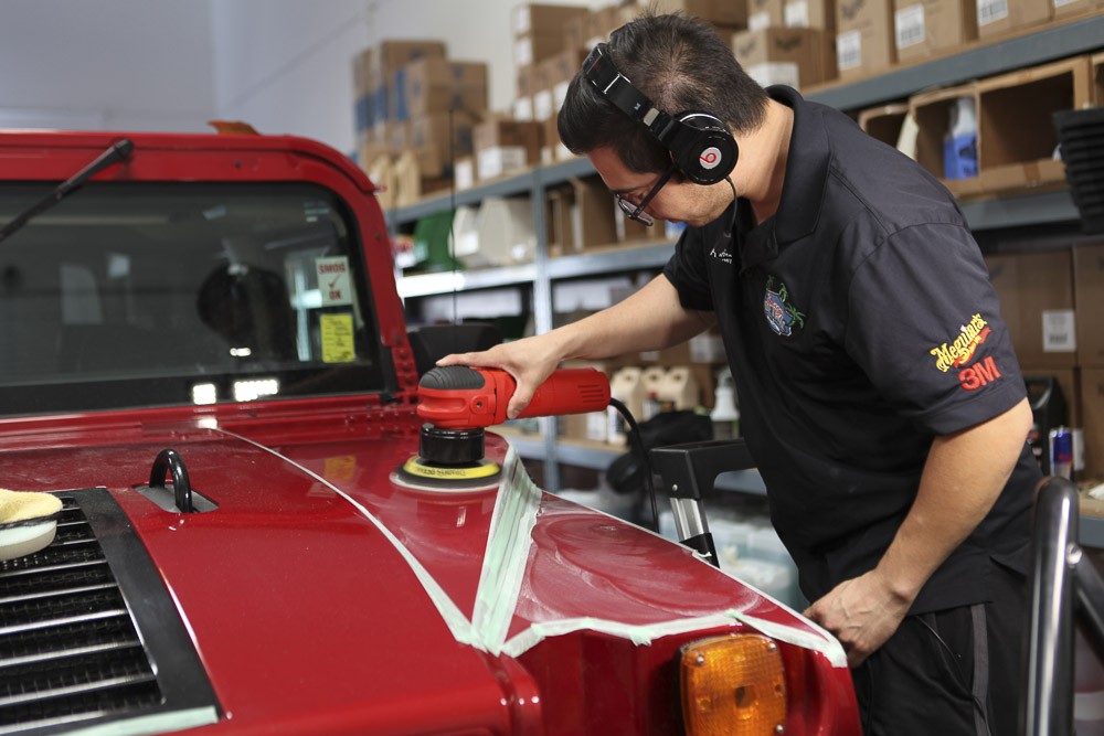 Our worker waxing a hood